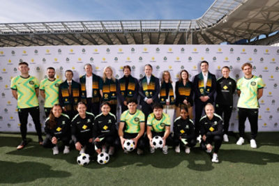 SYDNEY, AUSTRALIA - JUNE 19: George Houssos, Head of Corporate Affairs at Football Australia, Trevor Morgan, Head Coach of Young Socceroos, Jo Boundy, Executive General Manager, Chief Marketing Officer at Commonwealth Bank, Joe Montemurro, Head Coach of the Matildas, Matt Comyn, Managing Director and Chief Executive Officer at Commonwealth Bank Heather Garriock, Football Australia Interim CEO, Monique Macleod, Group Executive Marketing and Corporate Affairs at Commonwealth Bank and Tom Rischbieth, Chief Revenue Officer at Football Australia pose with Australian Football players during a CommBank Football Australia Announcement at CommBank Stadium on June 19, 2025 in Sydney, Australia. (Photo by Brendon Thorne/Getty Images)