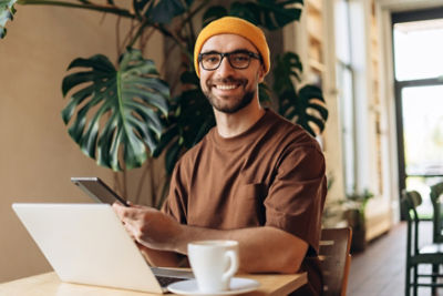 Man sitting at a table on laptop