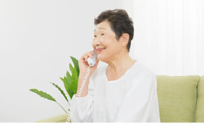 A woman using a landline phone