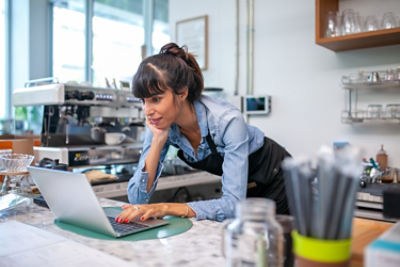 Cafe owner using computer