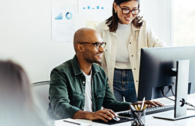 Workmates using a computer