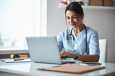 Doctor looking at a laptop