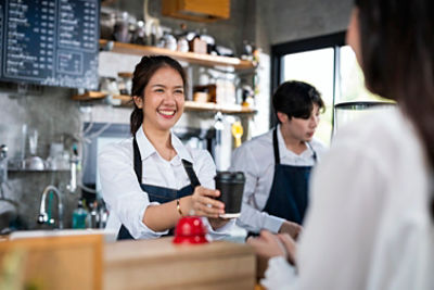 Paying for a coffee in a cafe