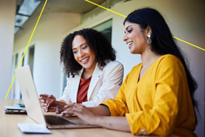 Regional landscape with rolling grass hills, a small lake, trees and a clear sky