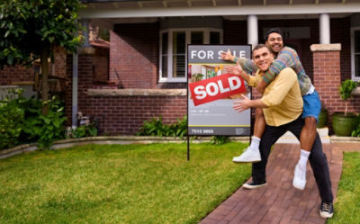 couple in front of house