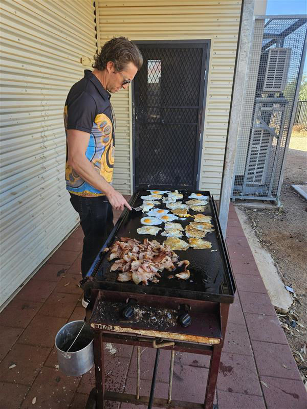Cooking breakfast for the Mimili community