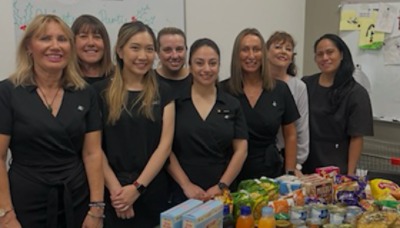 Eight CBA staff members smiling