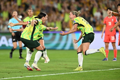CommBank Matilda Alanna Kennedy celebrates scoring the eqaliser goal with Sam Kerr at Stadium Australia. (AAP Image/Dean Lewins) 