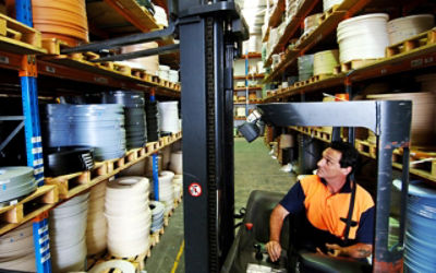 A worker storing goods by forklift in a warehouse in Sydney. Credit: AAP Image/Mick Tsikas