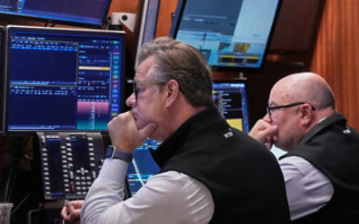 The Australian Stock Exchange ticker with a reflection of city pedestrians