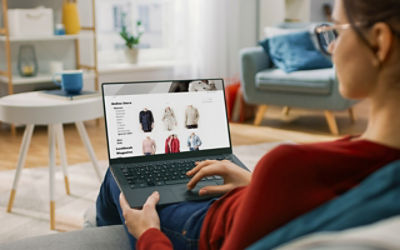 Young Woman at Home Using Laptop Computer for Browsing Through Online Retail Shopping Site