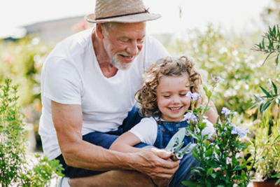 man gardening with young girl
