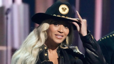 Beyonce tipping a cowboy hat. Credit: AAP