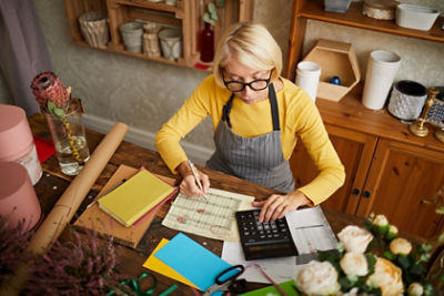 Business owner reviewing account books 