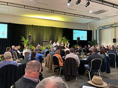 People on stage at a forum
