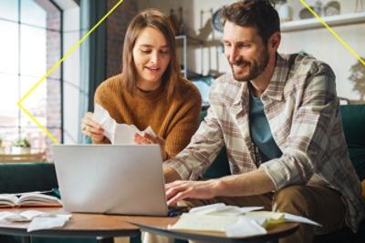 man and women looking at a laptop