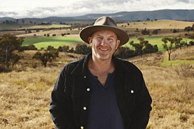 A photo of Matt Moran with a rural landscape as the background.