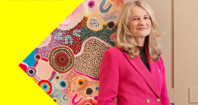 image of CEO of Aware Super, Deanne Stewart standing in pink business suit jacket