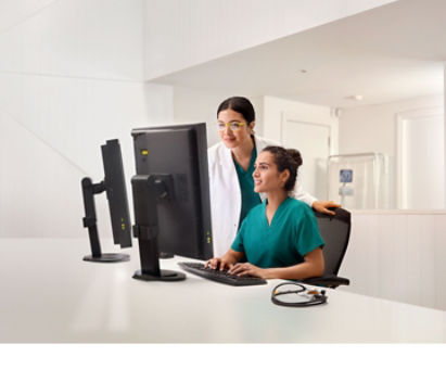 Image of a female doctor sitting in a chair at a desk