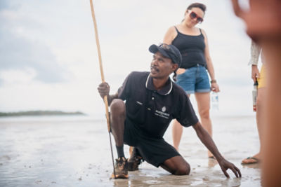 man spearfishing near ocean