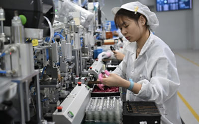 Workers assemble auto parts at a factory in Xiuning County, Huangshan City, east China's Anhui Province
