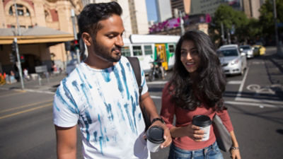 Coffee drinkers outside Flinders St Station in Melbourne. Credit: Adobe