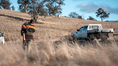 Agronomist on a farm practicing agronomy holding soil, doing soil tests in her home laboratory. Looking at soil life. Credit: Adobe