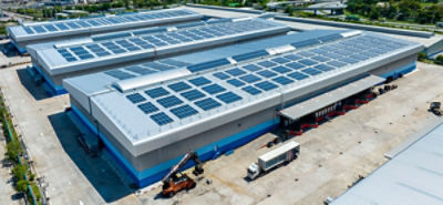 Solar panels on an industrial warehouse building. Picture: Adobe Stock