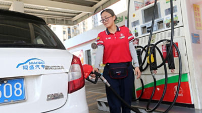 A worker refuels a car at a petrol station in Lianyun District, Lianyungang, east China's Jiangsu province, July 31, 2026. (Photo by Imaginechina/Sipa USA)
