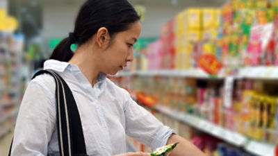 Woman shopping in a supermarket in China. Picture: Adobe