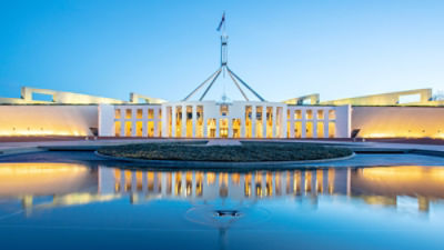 Parliament House, Canberra, at night. Credit: John White/Stocksy