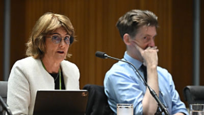 Governor of the Reserve Bank of Australia Michele Bullock speaks during the House of Representatives Standing Committee on Economics' first biannual public hearing at Parliament House in Canberra, alongside Deputy RBA Governor Andrew Hauser (AAP Image/Lukas Coch)