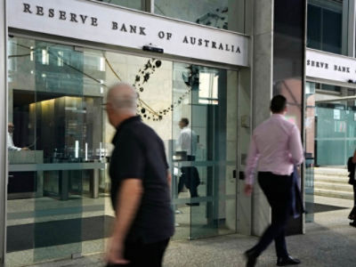 Pedestrians outside the RBA building in Sydney. AAP