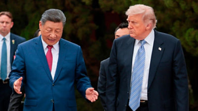 U.S. President Donald Trump, right, walks with Chinese President Xi Jinping while leaving after a visit to the Zhongnanhai Garden in Beijing, Friday, May 15, 2026. (Evan Vucci/Pool Photo via AP)