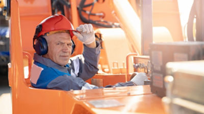 Woker operating machinery