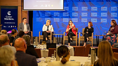 Rebecca Warren speaks on a panel at the Cyber Wardens Research Summit
