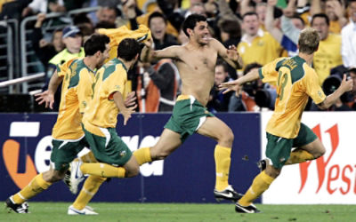 Australian players from left, Tony Vidmar, Scott Chipperfield, John Aloisi and Vincent Grella celebrate after defeating Uruguay on penalties during their second leg World Cup qualifier against Uruguay at Sydney's Olympic Stadium, Wednesday, Nov. 16, 2005 Australia booked a World Cup soccer finals berth for the first time since 1974. (AP Photo/Mark Baker)