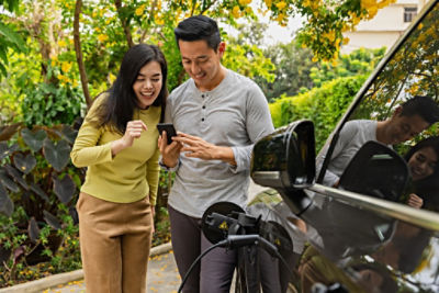 Couple with electric car