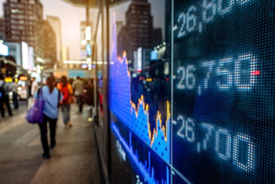 man observing printed items