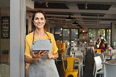 Cafe owner holding an ipad