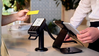 Man paying using a card machine