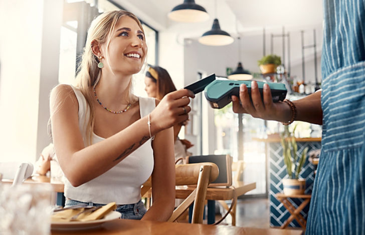 Women paying by credit card